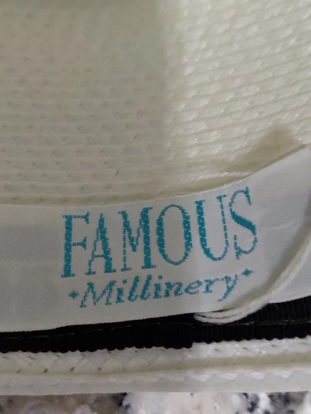Elegant White Women's Fascinator Hat with Black Trim FAMOUS BRAND